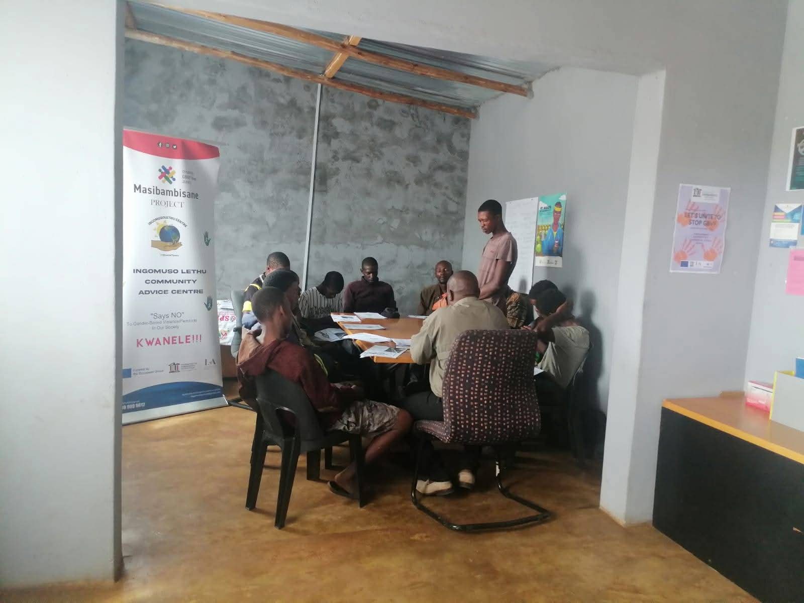 Participants seated in a Khuluma Ndoda dialogue session