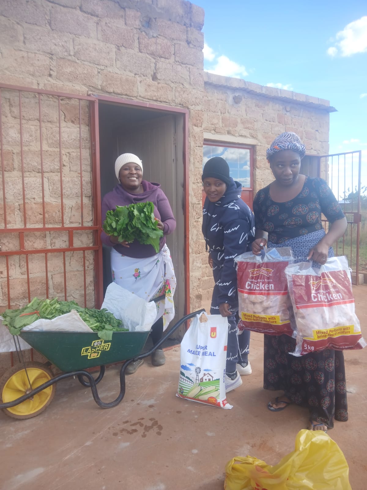 Community members with garden harvest supplies