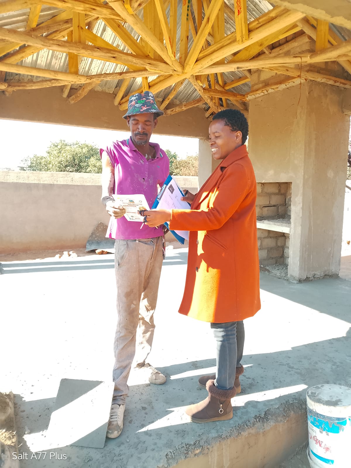 Community members at a garden pavilion activity