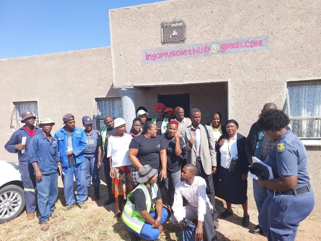 SAPS and community partners standing together outside